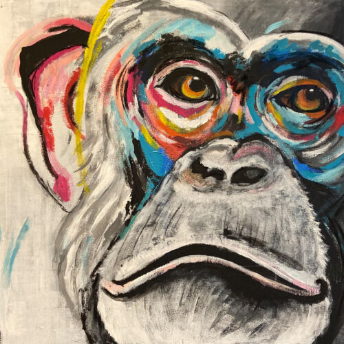 Das Gemälde Schimpansenporträt zeigt ein Schimpansengesicht in schwarz weiss mit bunten Akzenten um die Augen